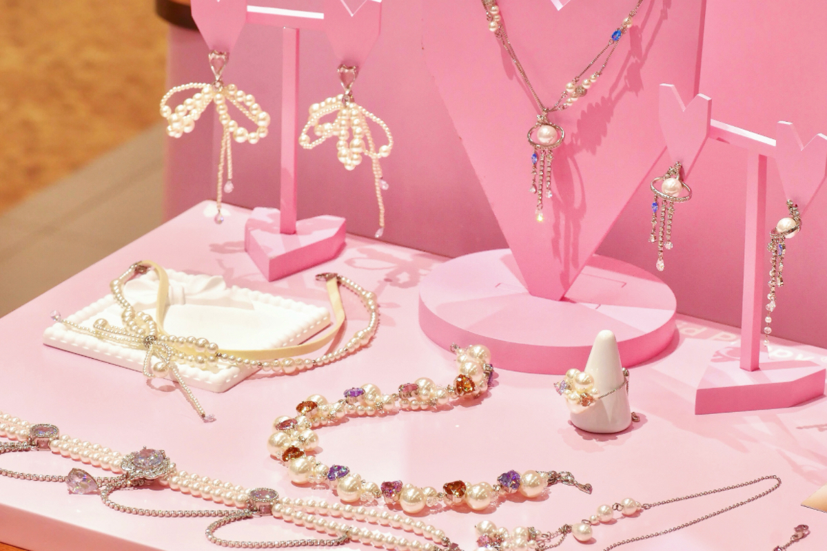Pink in-store display of pearl and crystal jewelry